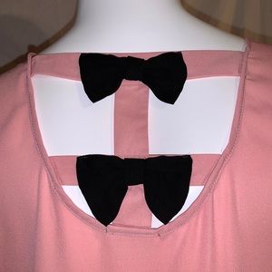 Timing pink tunic with black bows. 2X